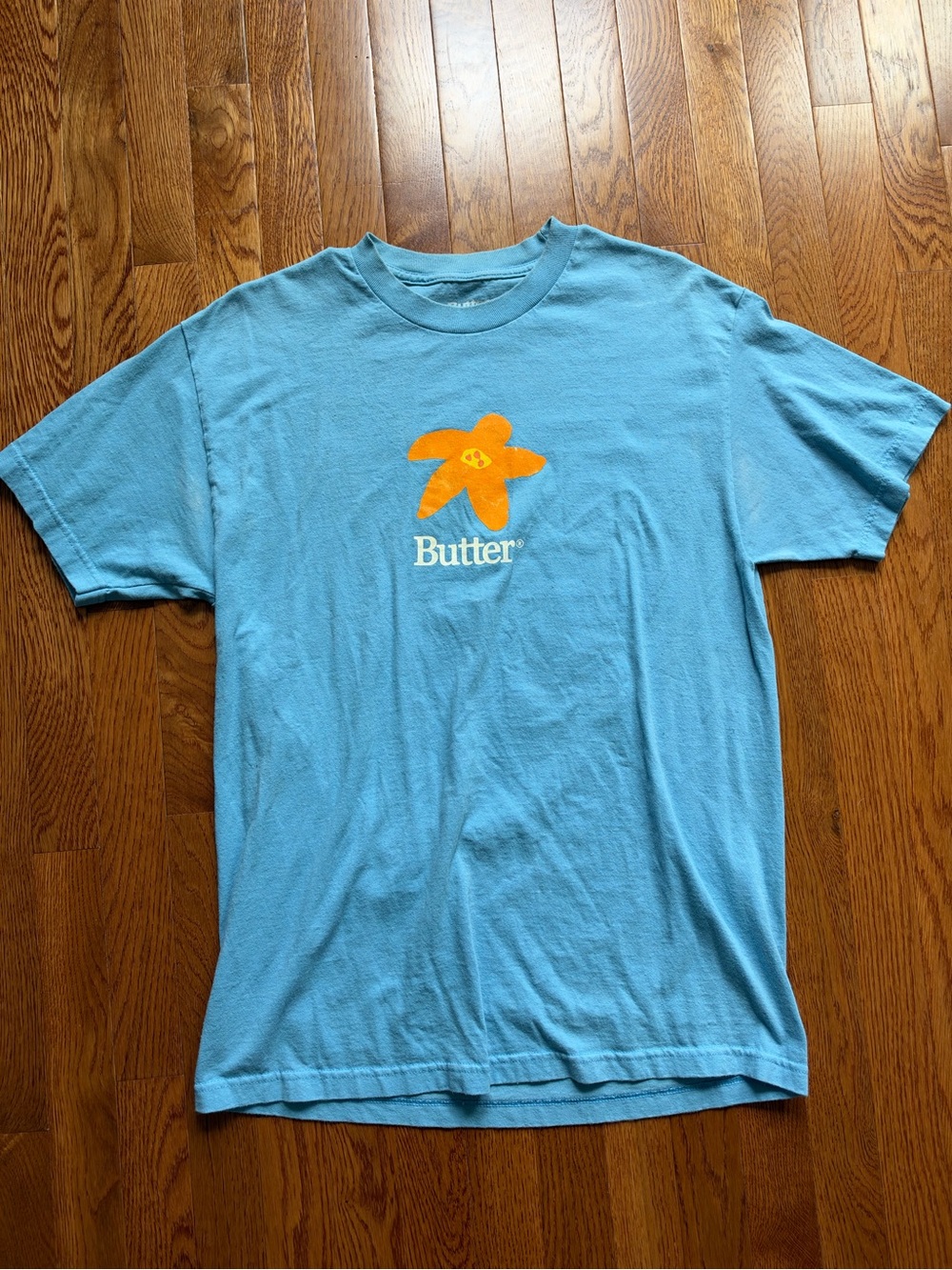 Butter Light Blue Tee with Orange Flower Graphic